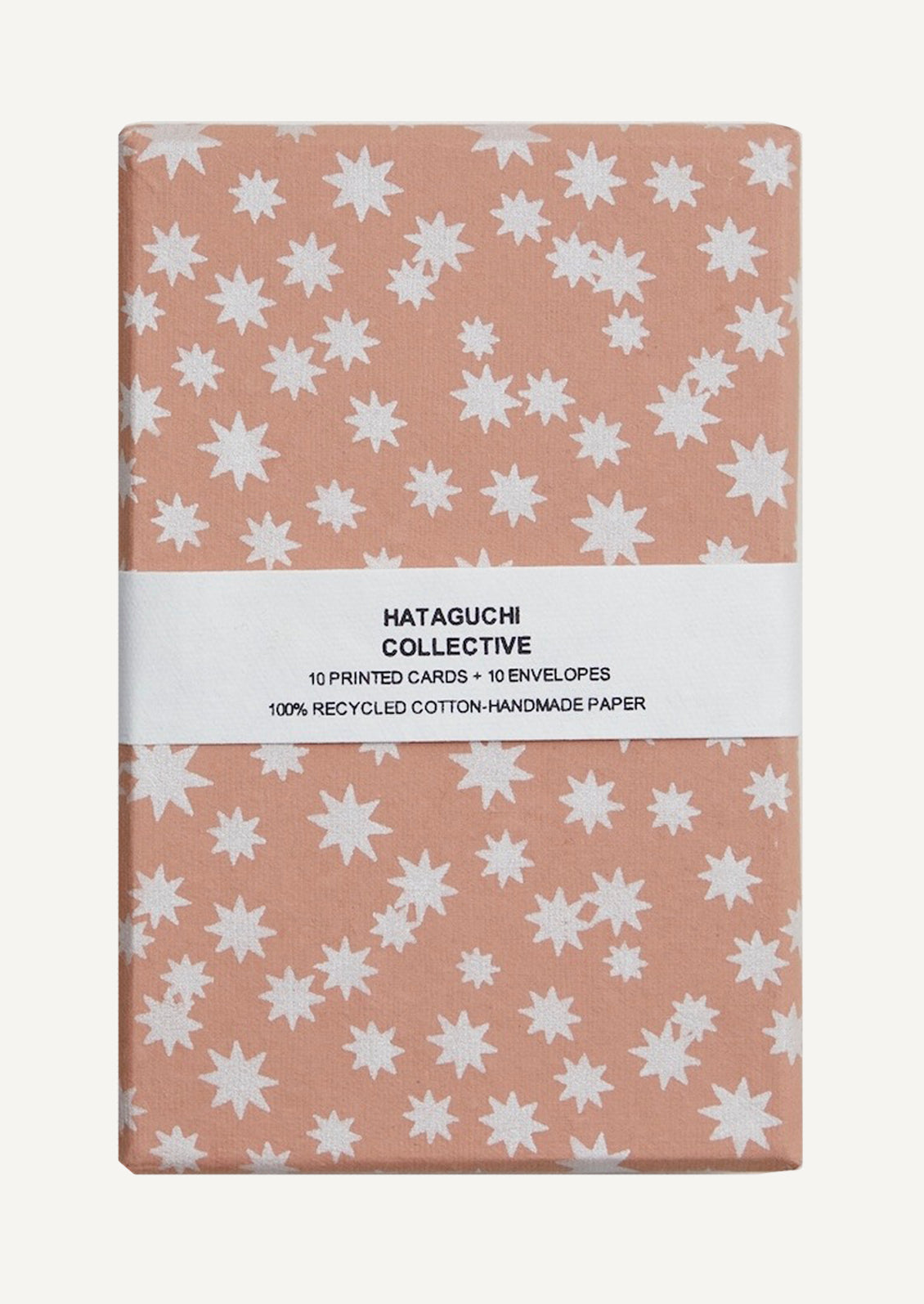 A set of cards in peach and white star print box.