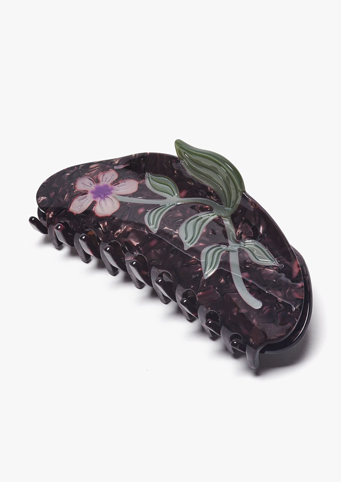 A dark brown acetate hair claw with purple flower.