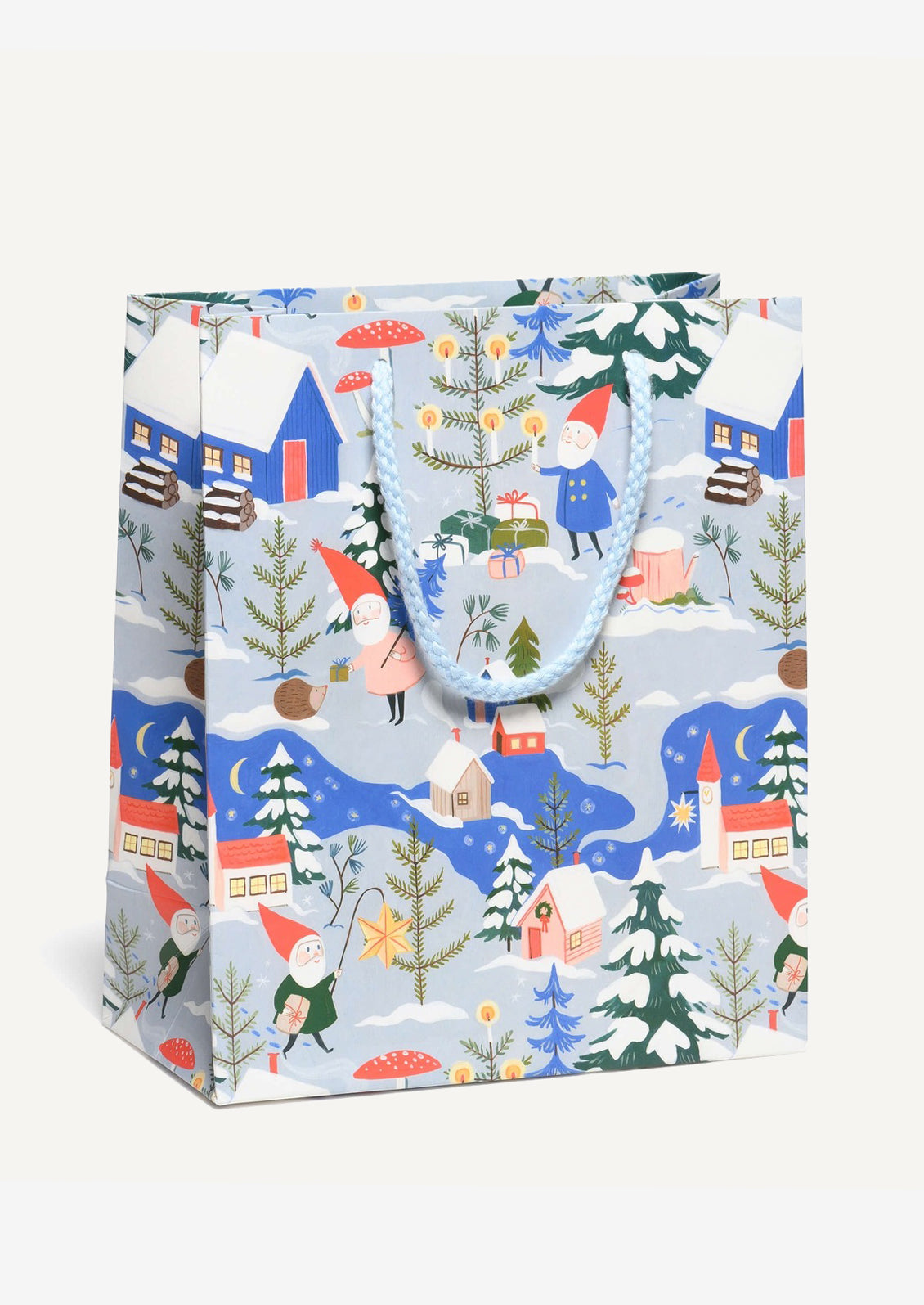 A medium printed gift bag in blue with holiday gnomes print.