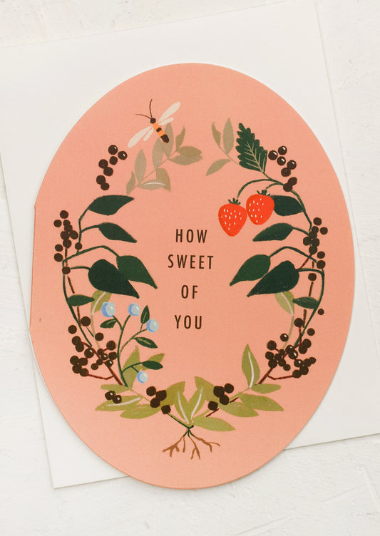 An oval shaped floral print card, text reads "How Sweet Of You".