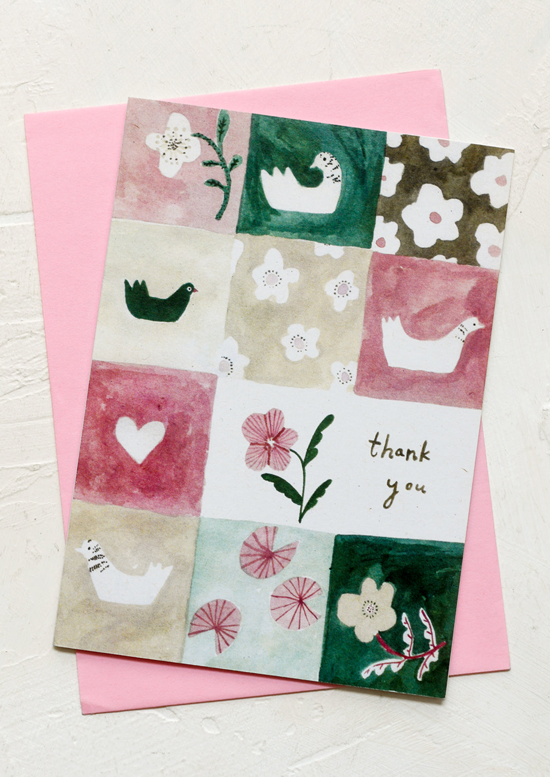 A thank you card with pink and green patterned quilt pattern.