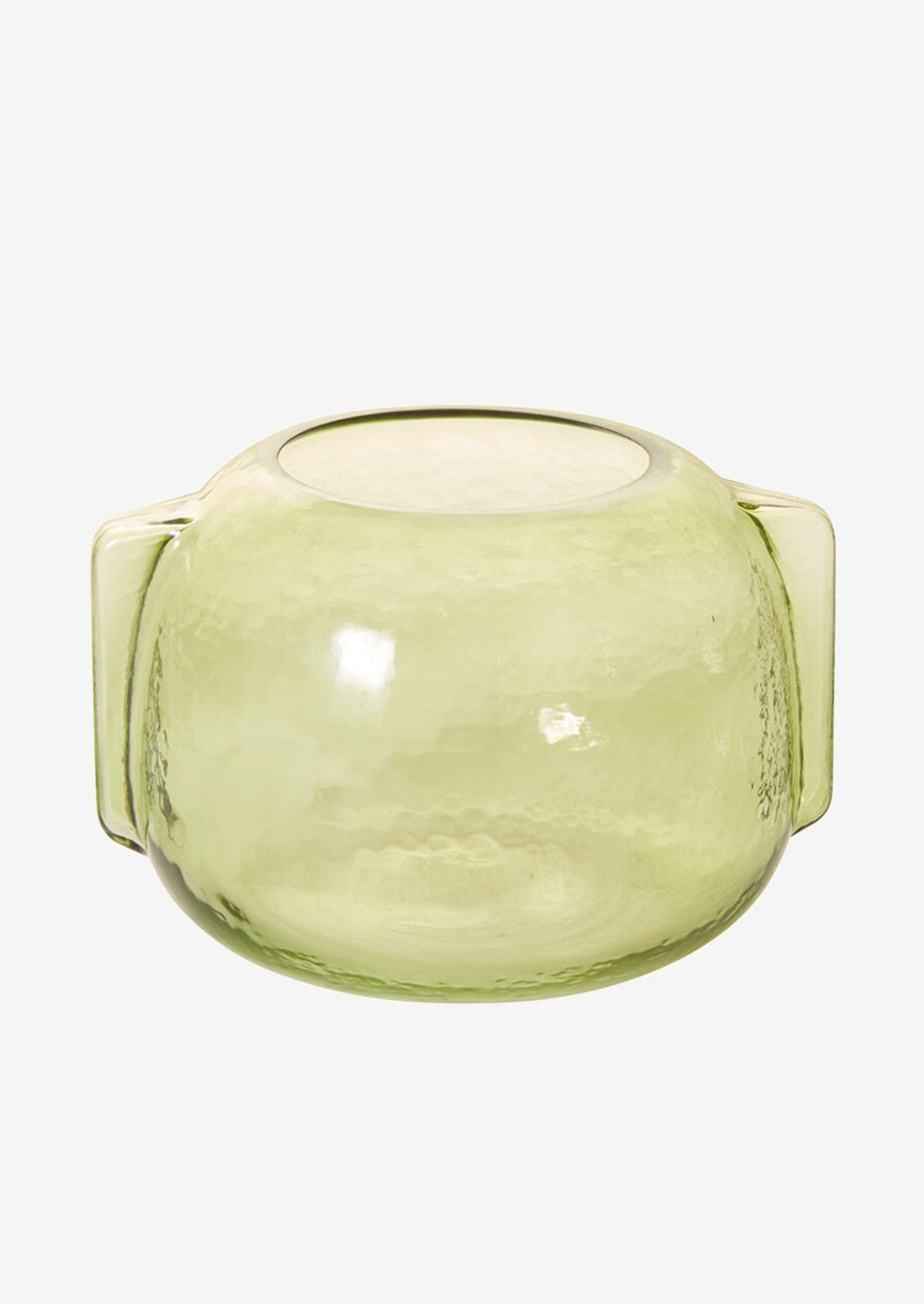 A transparent green glass vase in short/wide shape with side handle detail.