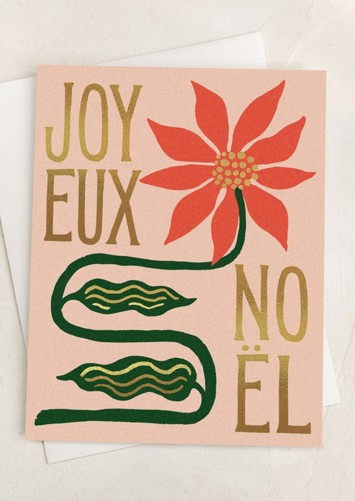 A card with image of poinsettia, text reads "Joyeux Noel".