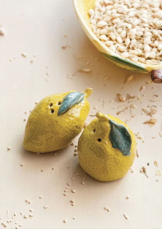 A set of lemon shaped salt and pepper shakers.