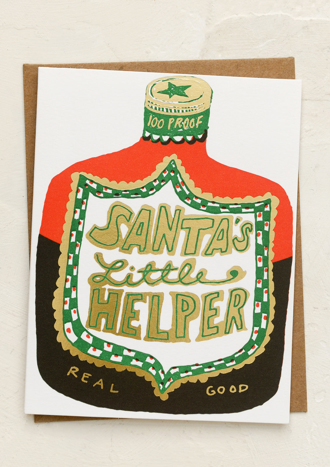 A card with illustration of bottle of whiskey, text reads "Santa's Little Helper".