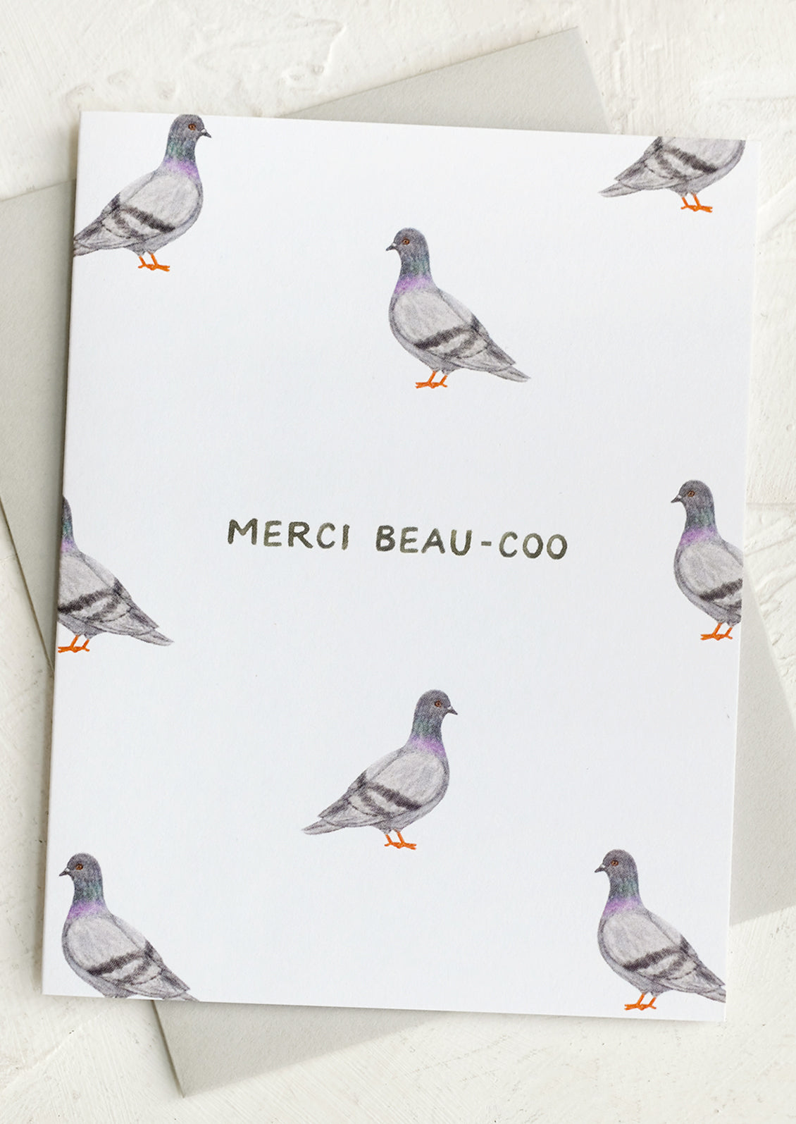 A pigeon print card reading "Merci Beau-coo".