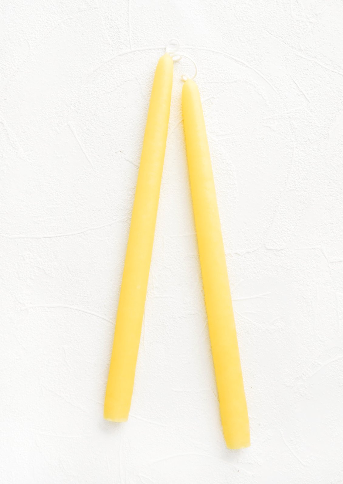 Pair of taper candles in daffodil yellow