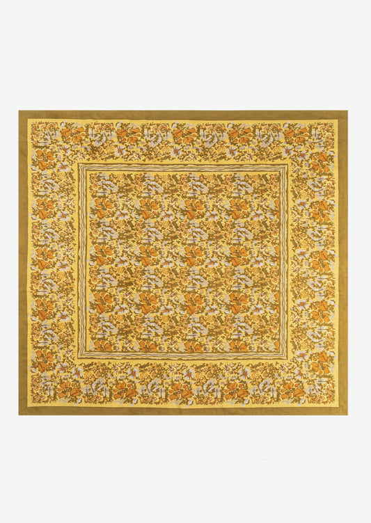 A mustard floral print tablecloth.