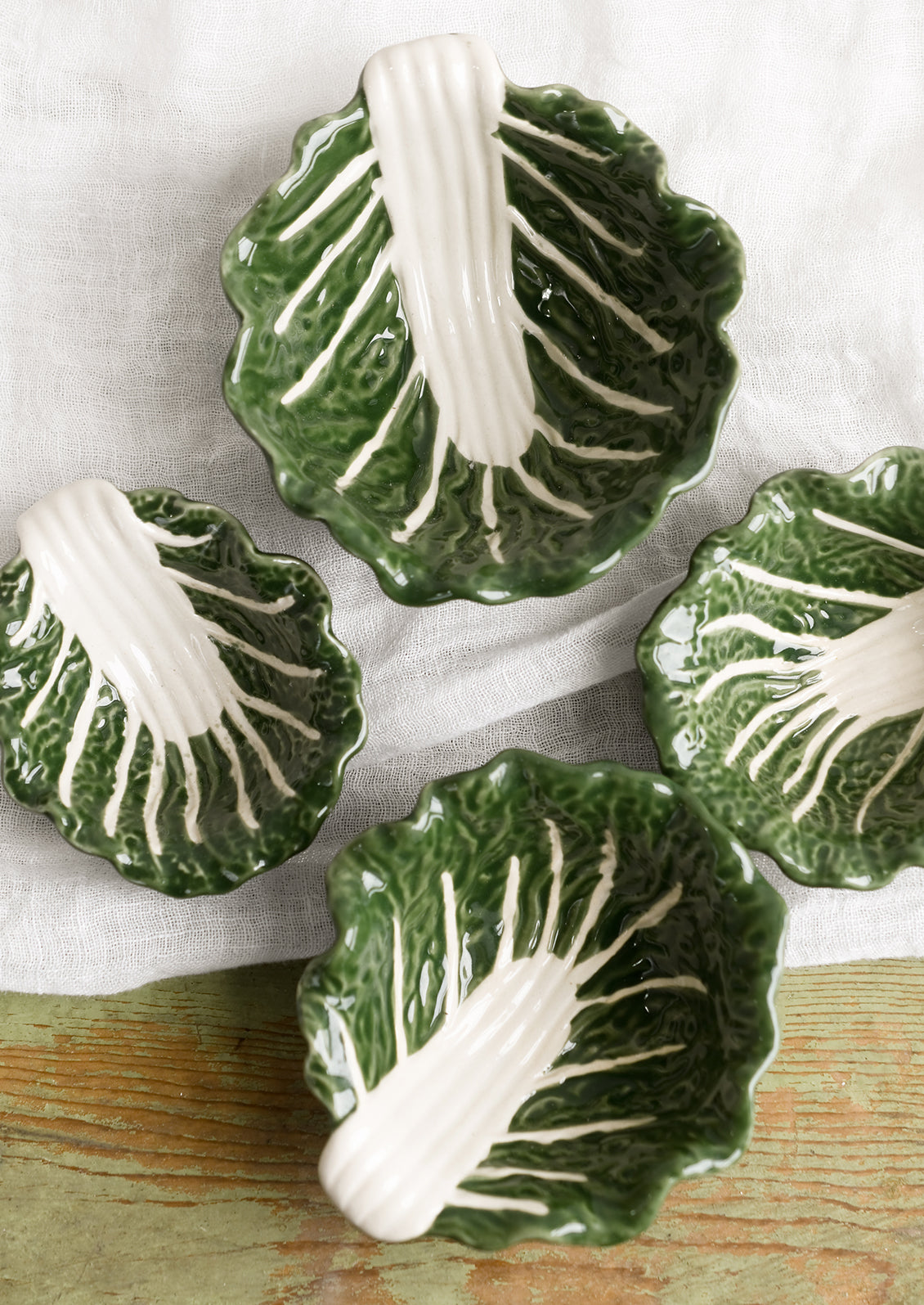 Cabbageware style ceramic bowls that look like green cabbage.