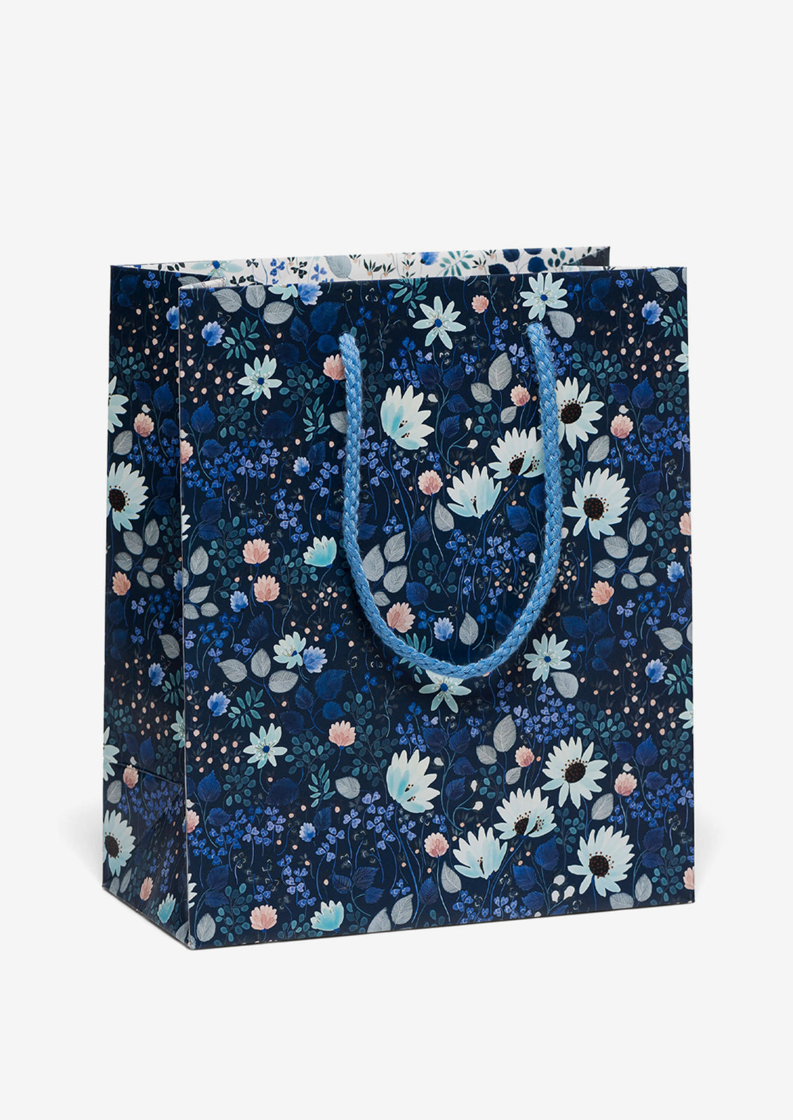 A printed gift bag with blue floral print on dark blue background.