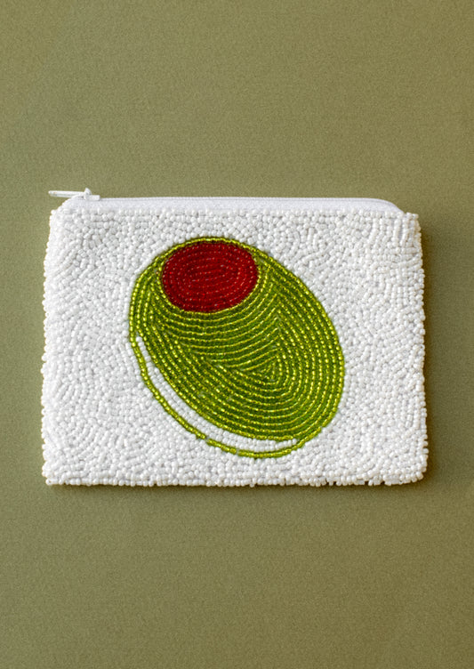 A white beaded coin pouch with green pimento olive design.