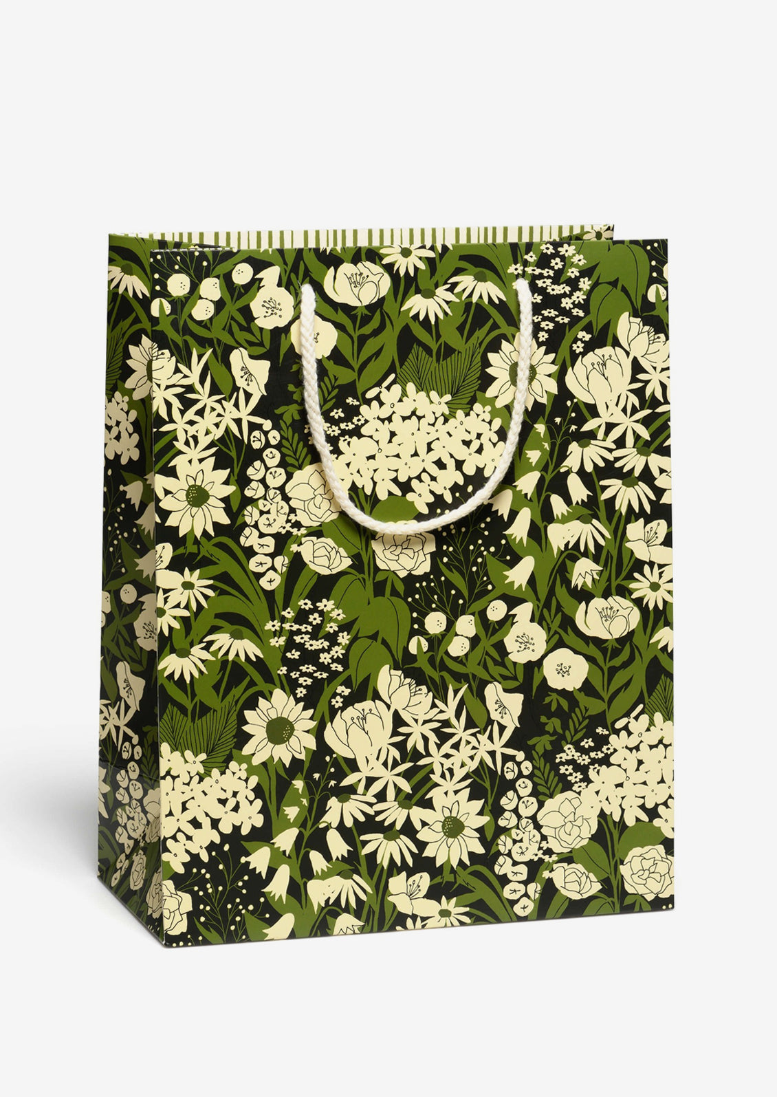 A printed gift bag with green and white floral print on black.