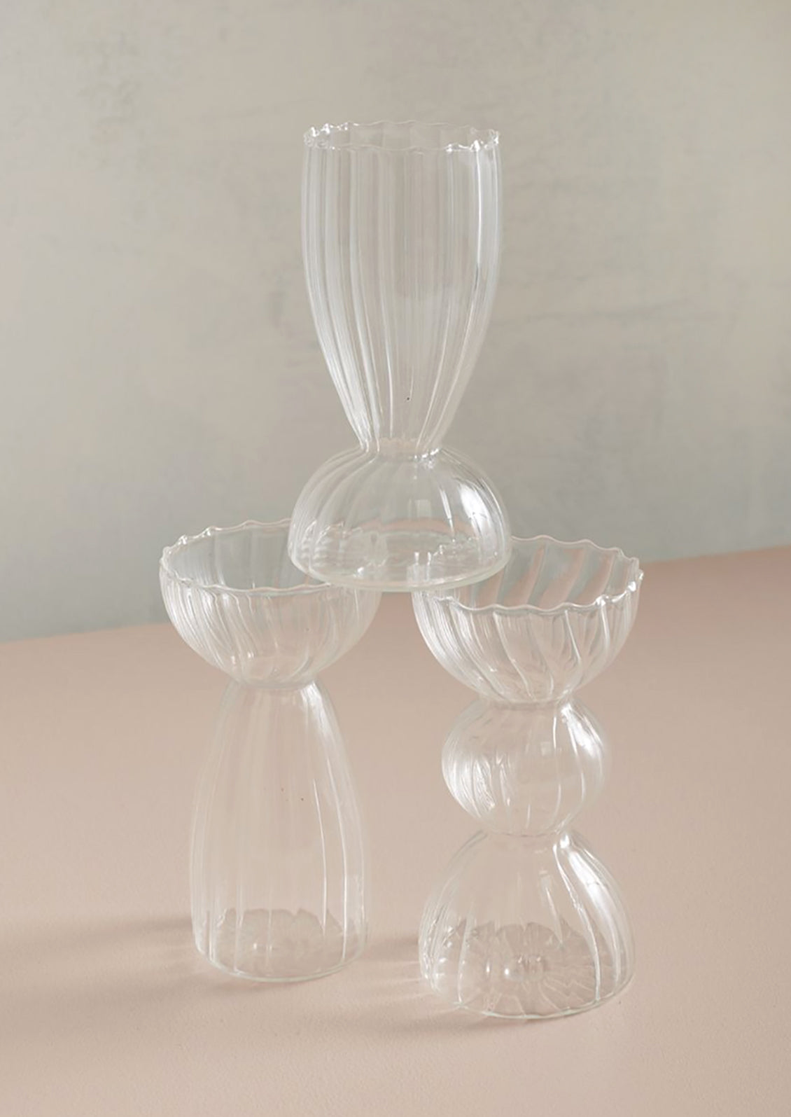 Optic glass bud vases in three different styles.