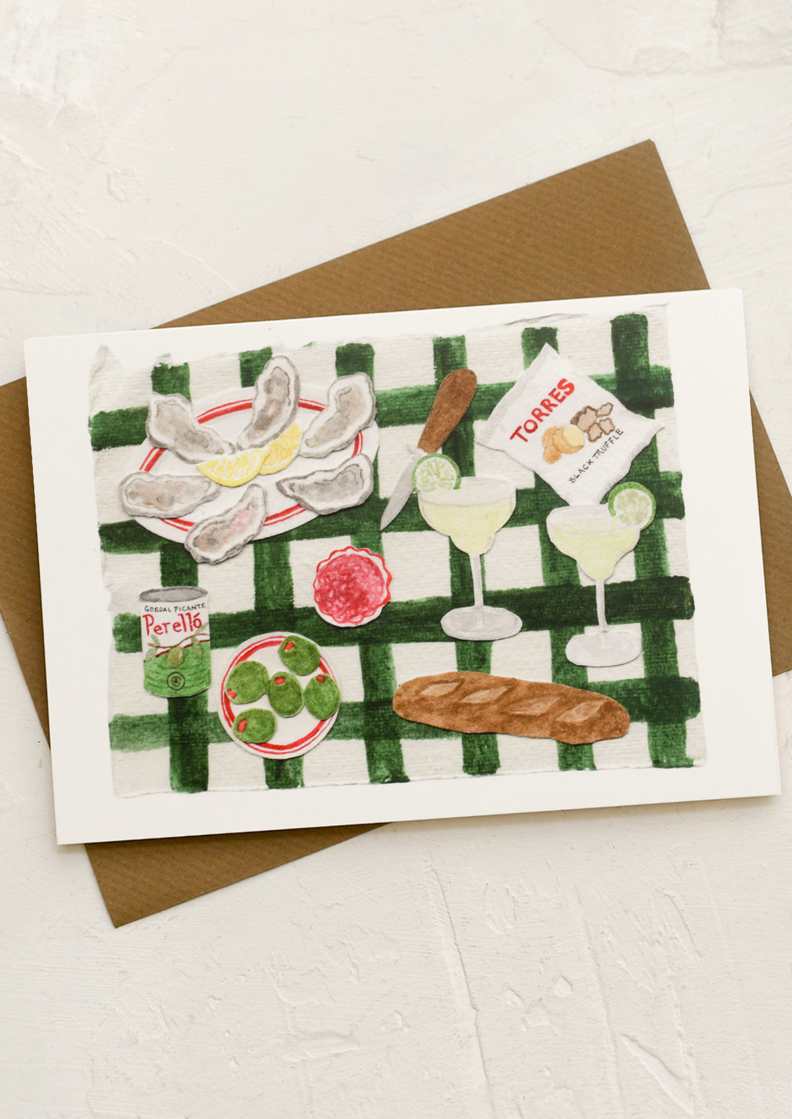 A greeting card with collage still life scene of picnic items.