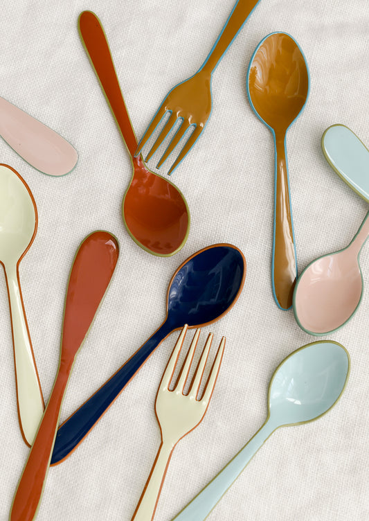 Colorful enamel spoon, fork and spreader knives in a fun mix of colors.