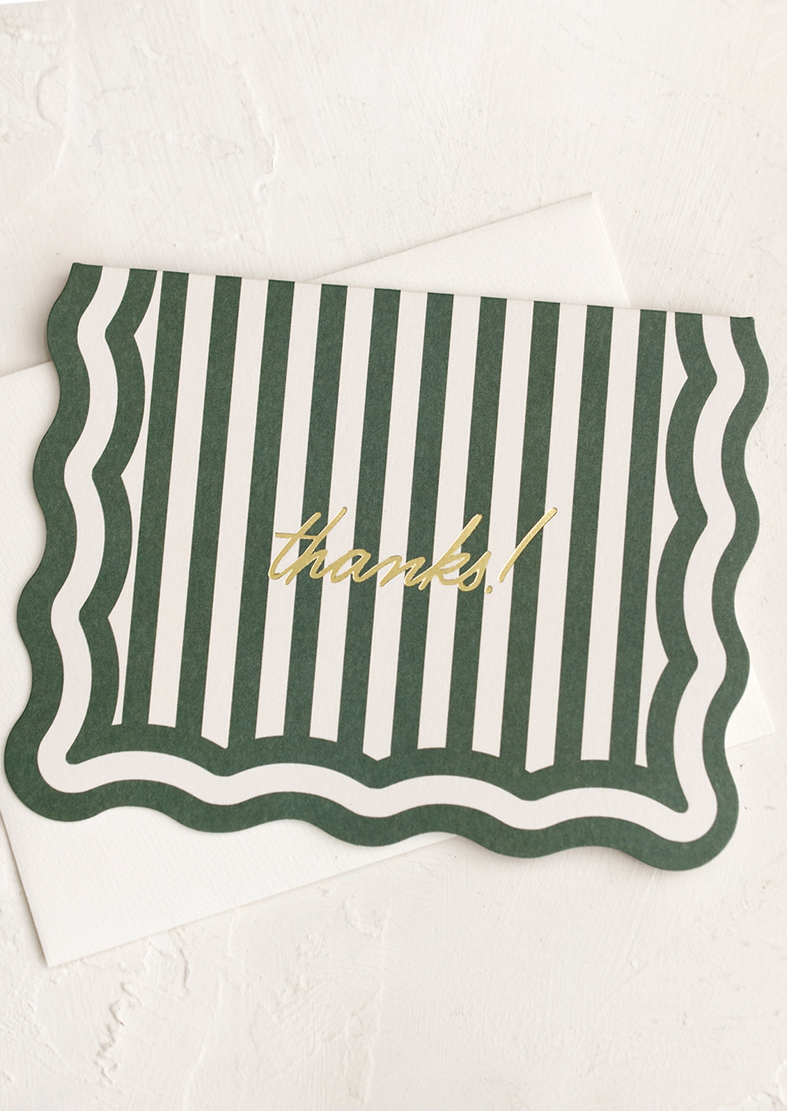 A wavy edge diecut card in green stripes reading "Thanks!".