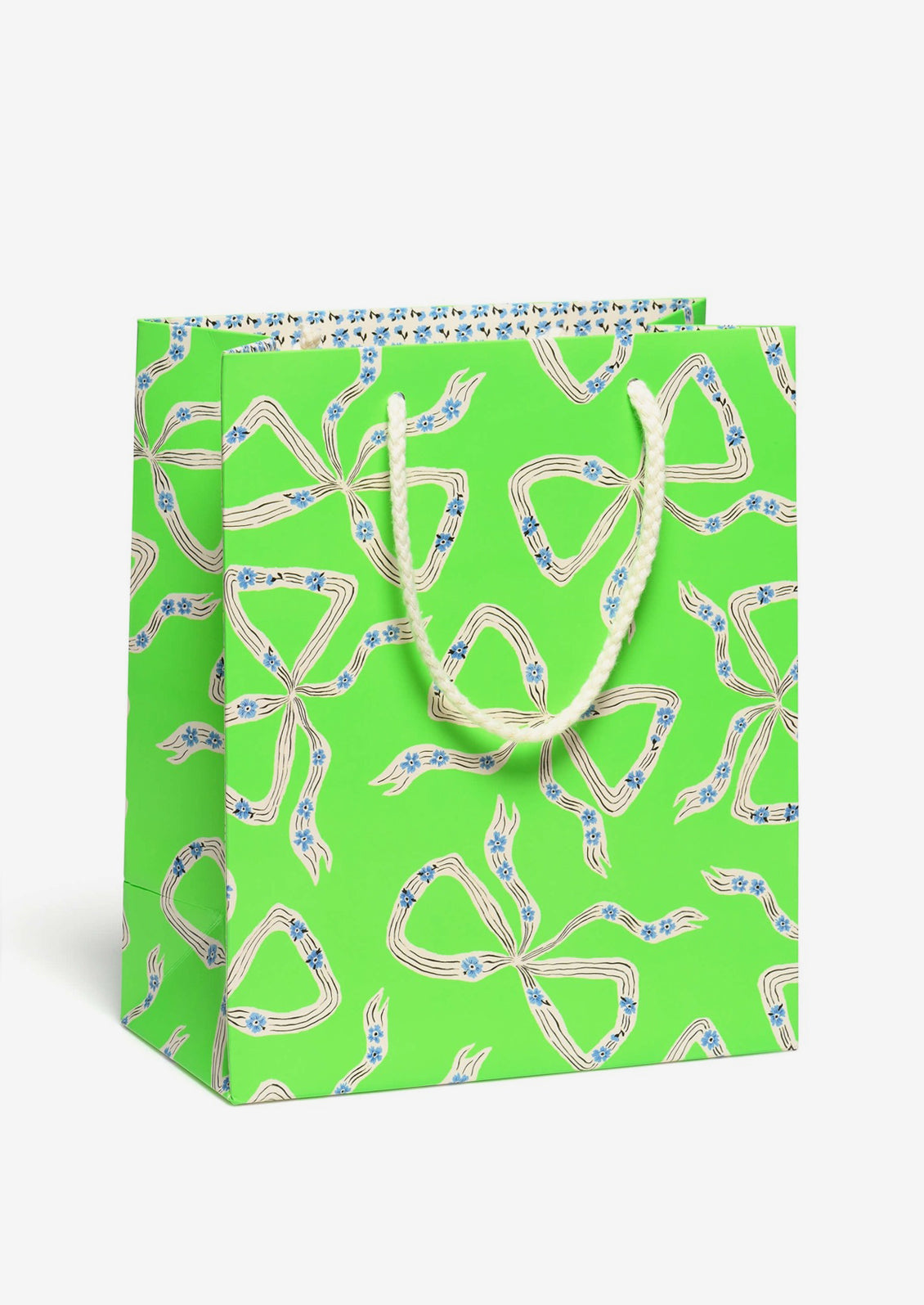 A printed gift bag with blue and white bow print on neon green background.