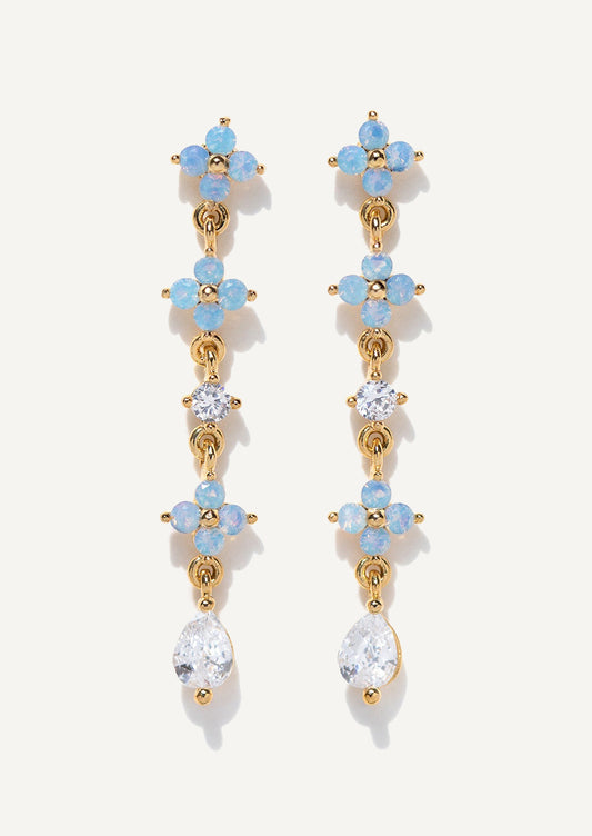 A pair of dangling earrings in light blue floral with clear crystals.