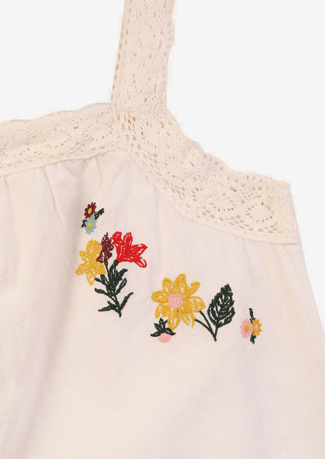 A white cotton shirt with multicolor floral embroidery.