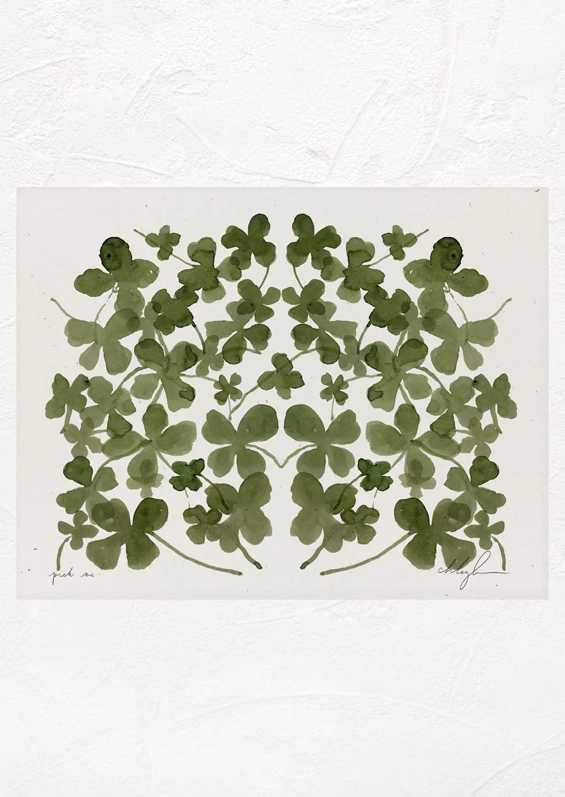 An art print with a mirrored image of multiple four leaf clovers.