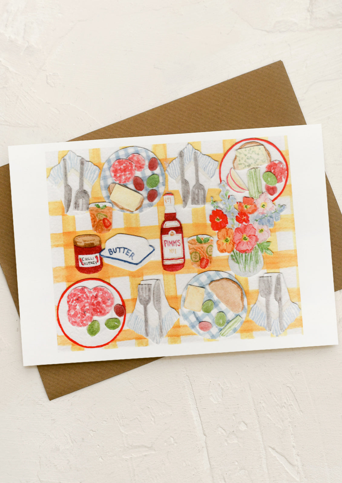 A greeting card with collage still life scene of picnic items.