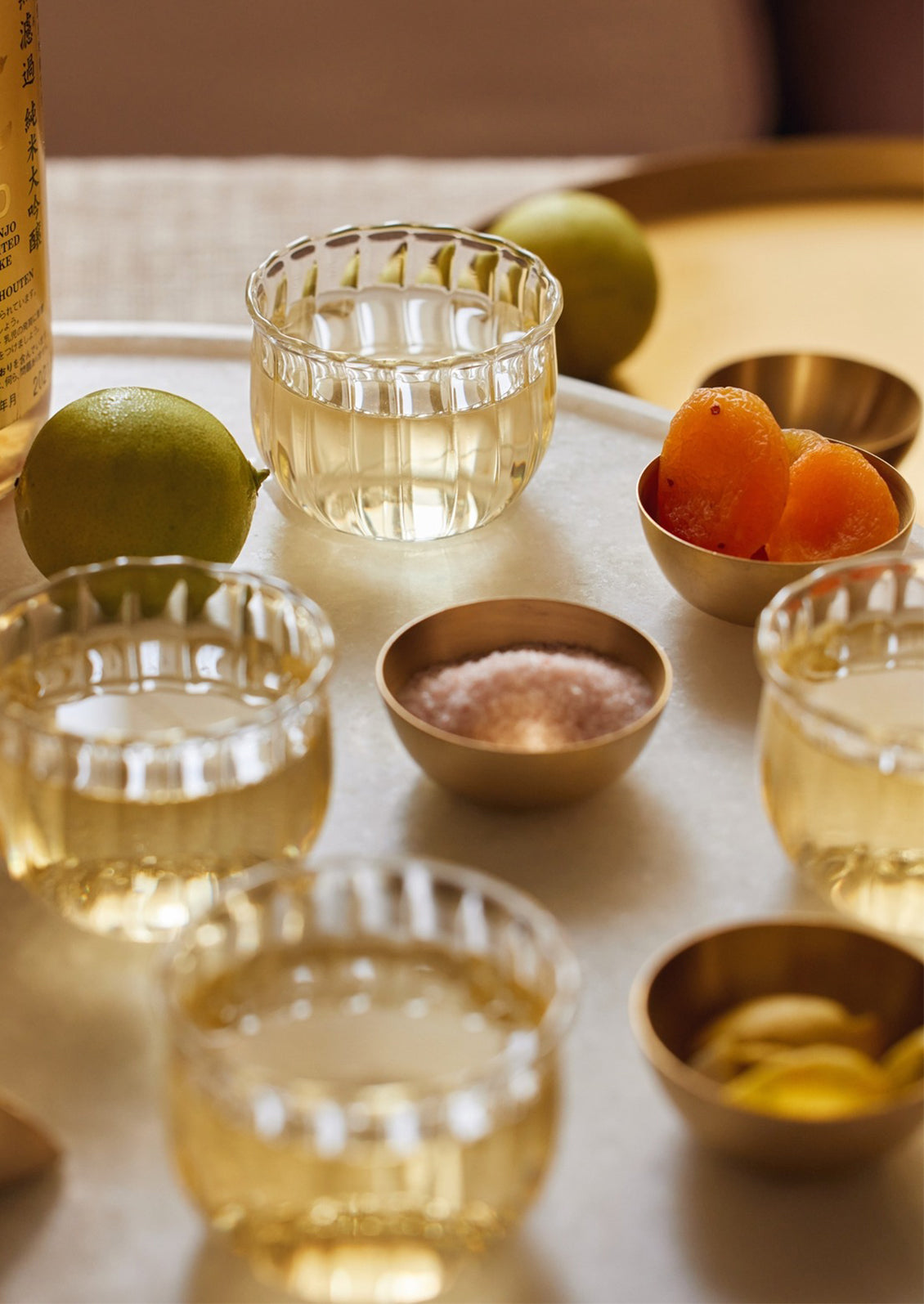 Mini brass pinch bowls holding salt, dried fruit, etc.