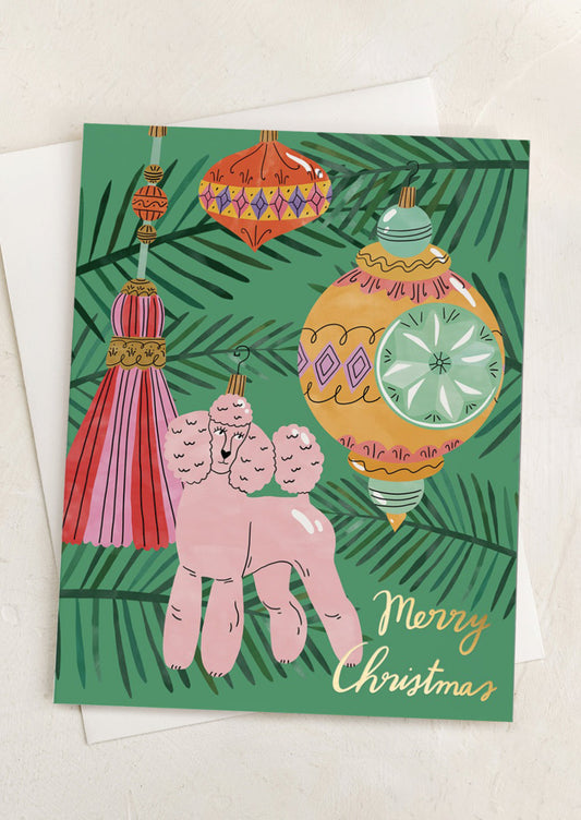 A card with image of poodle ornament, text reads "Merry Christmas".