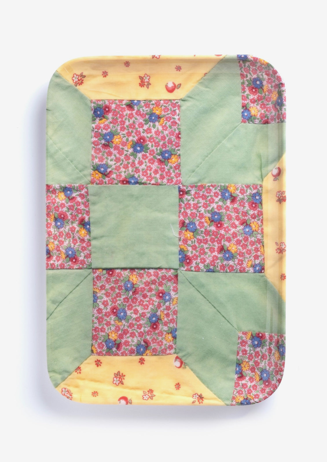 A patterned melamine tray in quilt pattern.