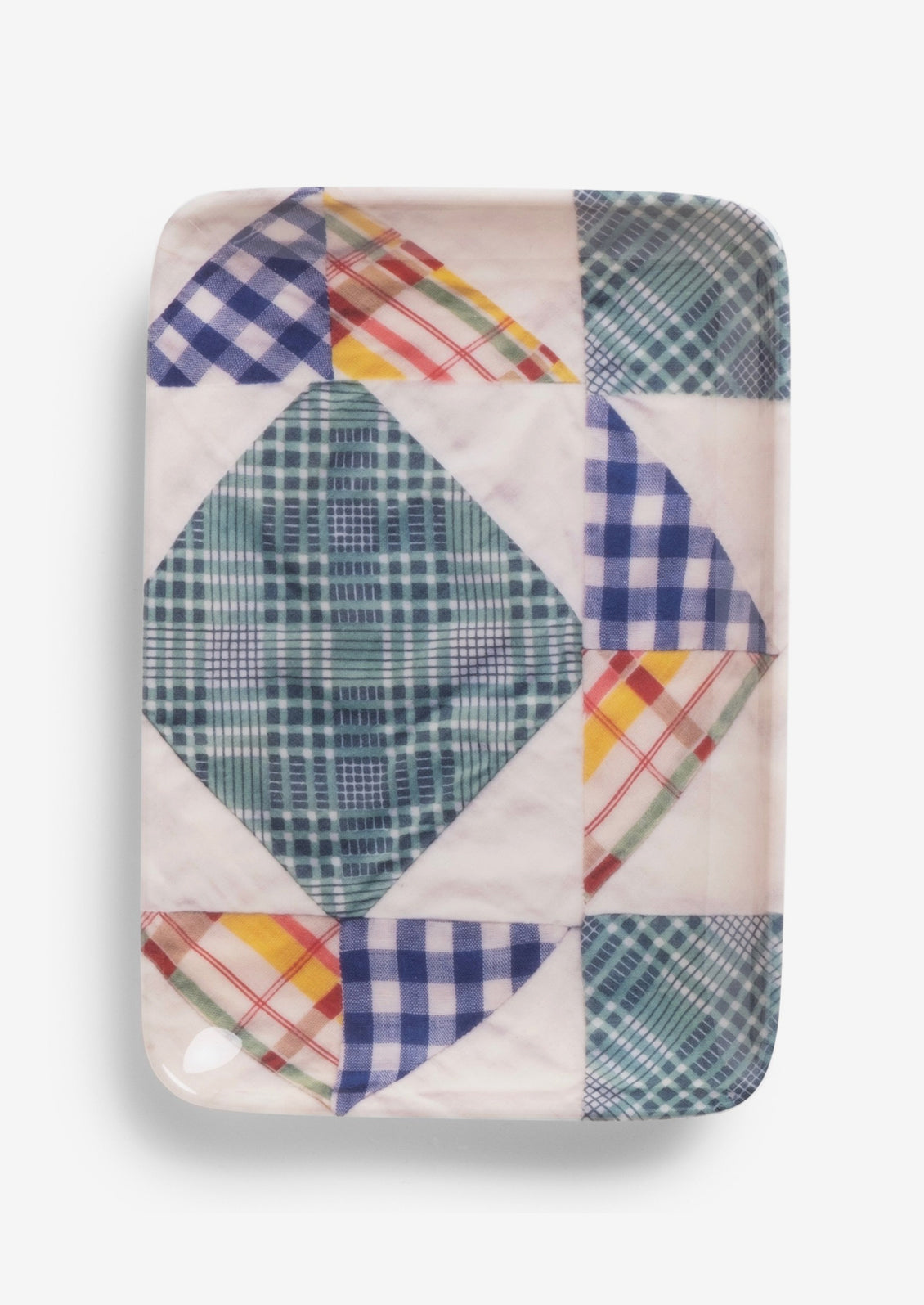 A patterned melamine tray in quilt pattern.