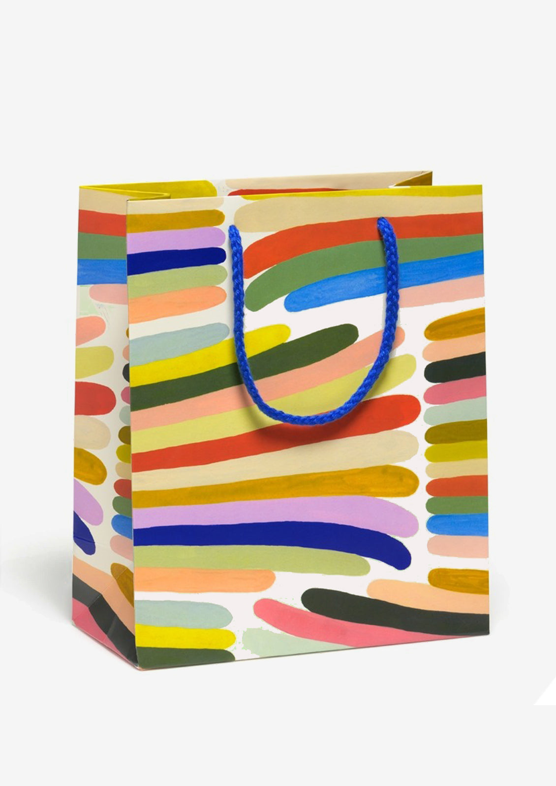 A printed gift bag with colorful rainbow stripe pattern.