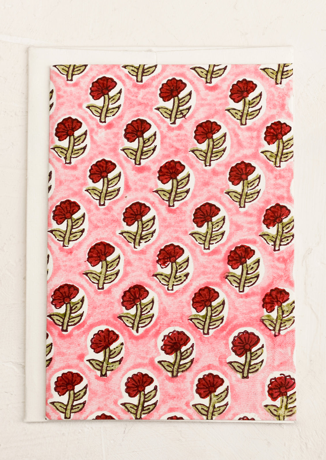 A block print card with pink and red floral.