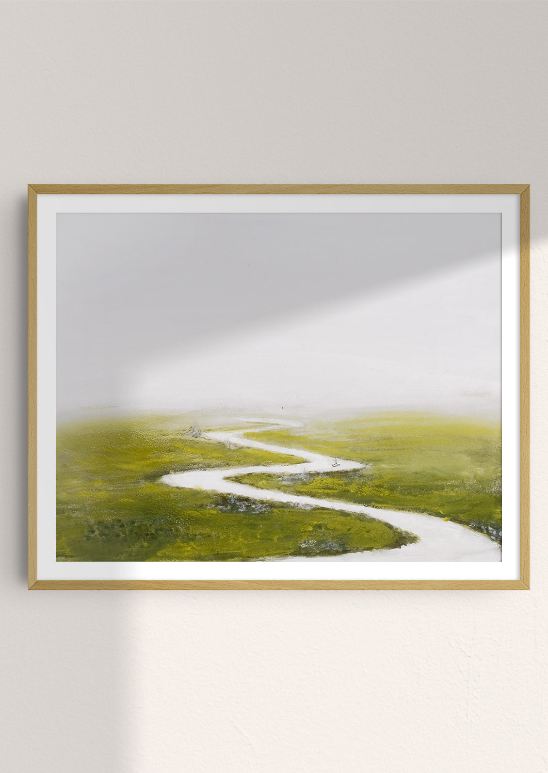 An art print of original painting depicting white river through green flatland, framed.