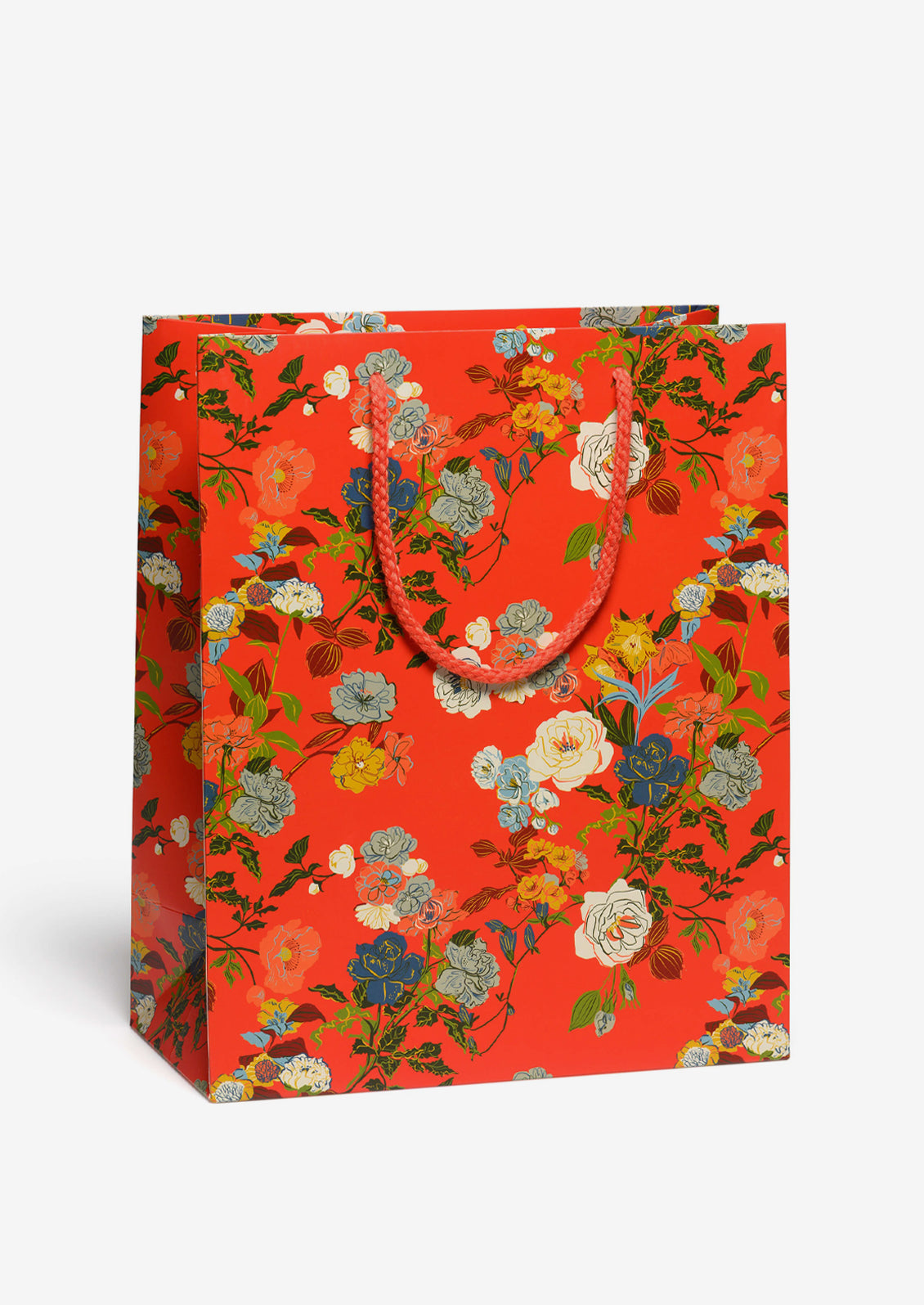 A printed gift bag with rose floral print on red background.