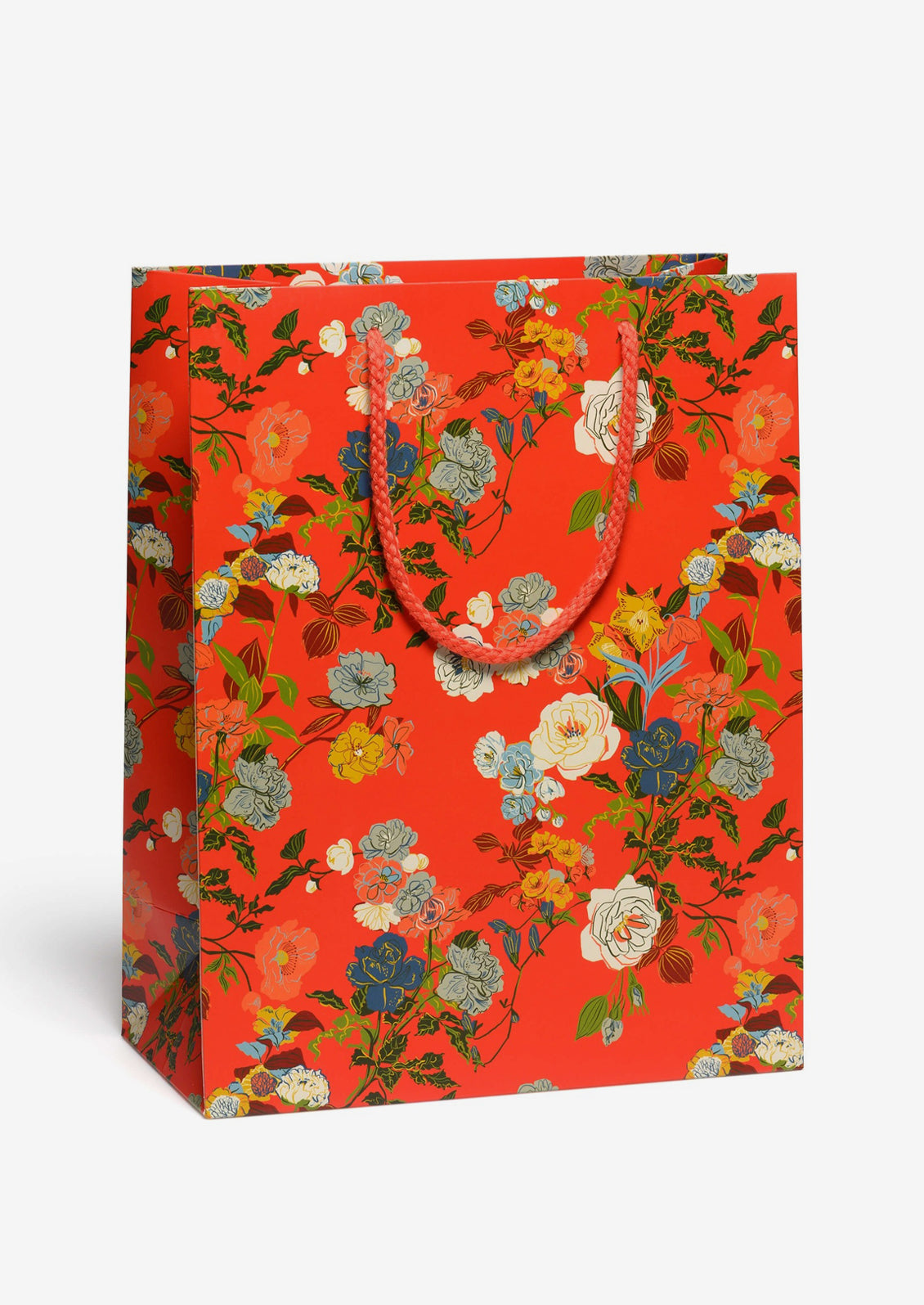 A printed gift bag with rose print on red background.