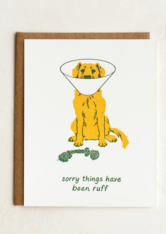 A card with illustration of dog wearing cone, text reads "Sorry things have been ruff".