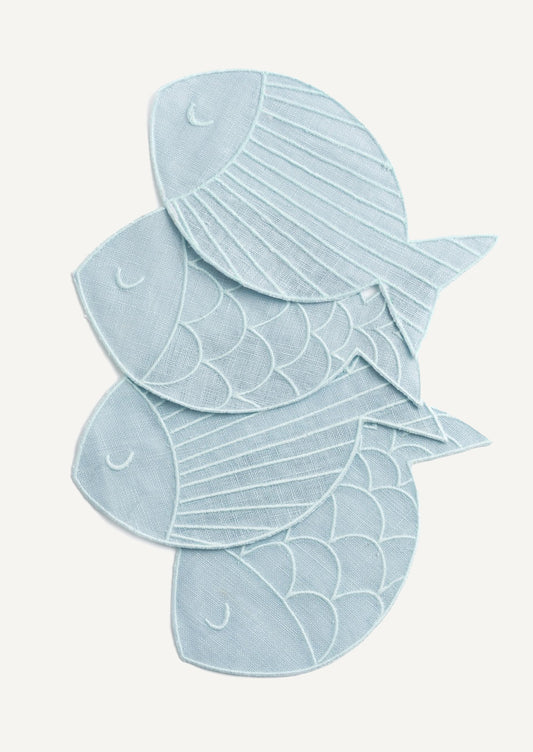 A set of four fish shaped cocktail napkins in sky blue linen.