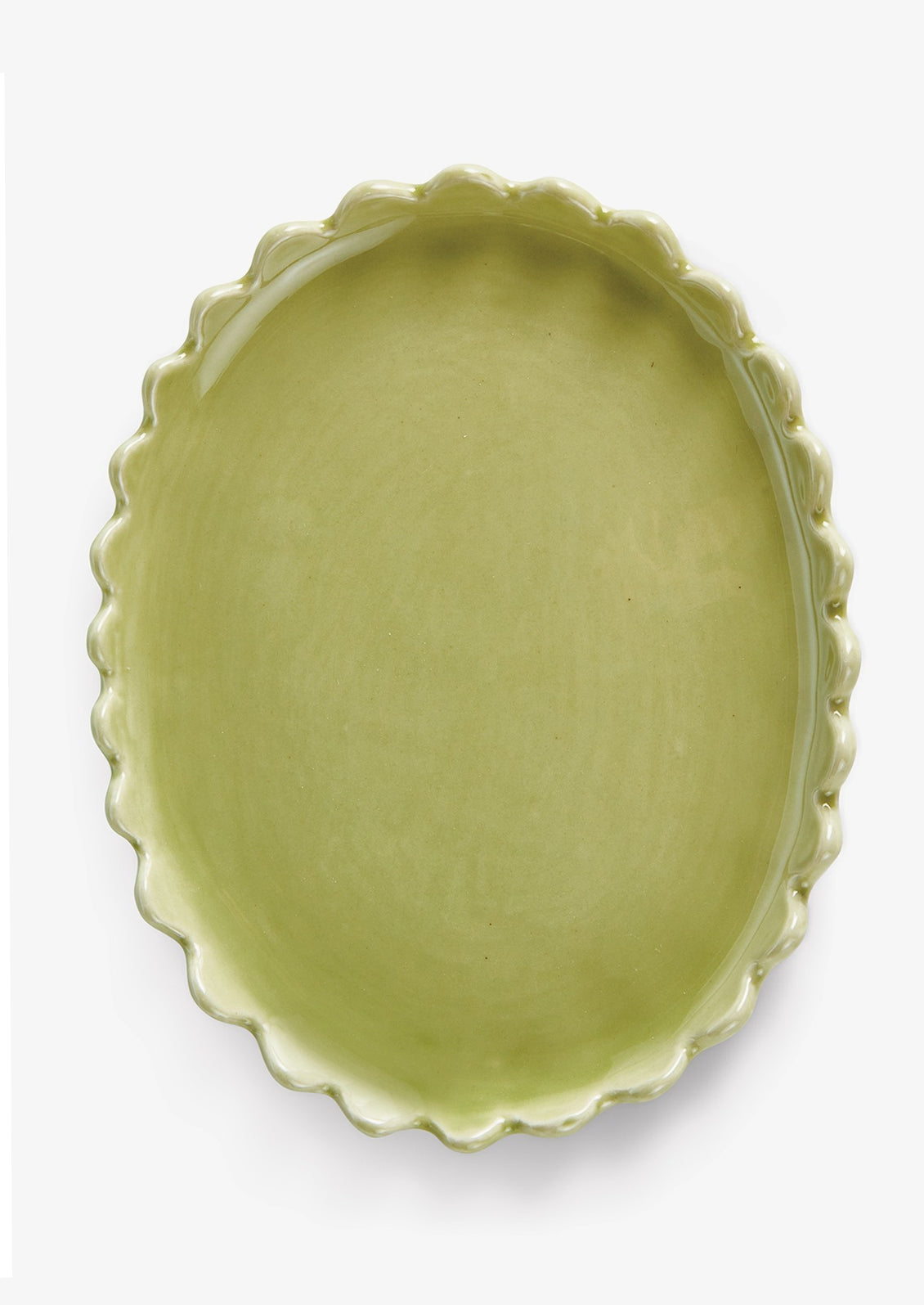 A green ceramic oval tray with scalloped edges.