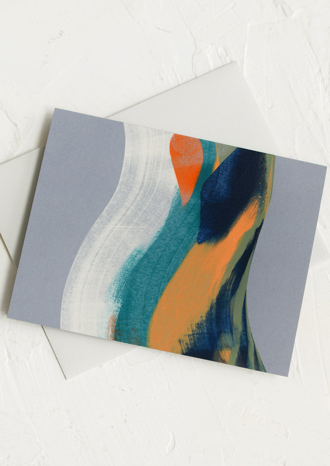 A grey card with hand painted strokes of orange, green and blue.