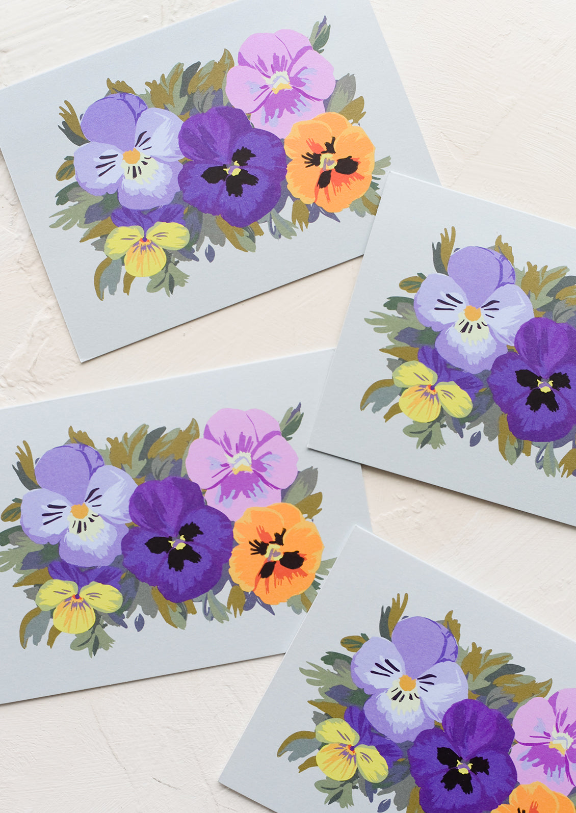 A set of blue pansy printed greeting cards.