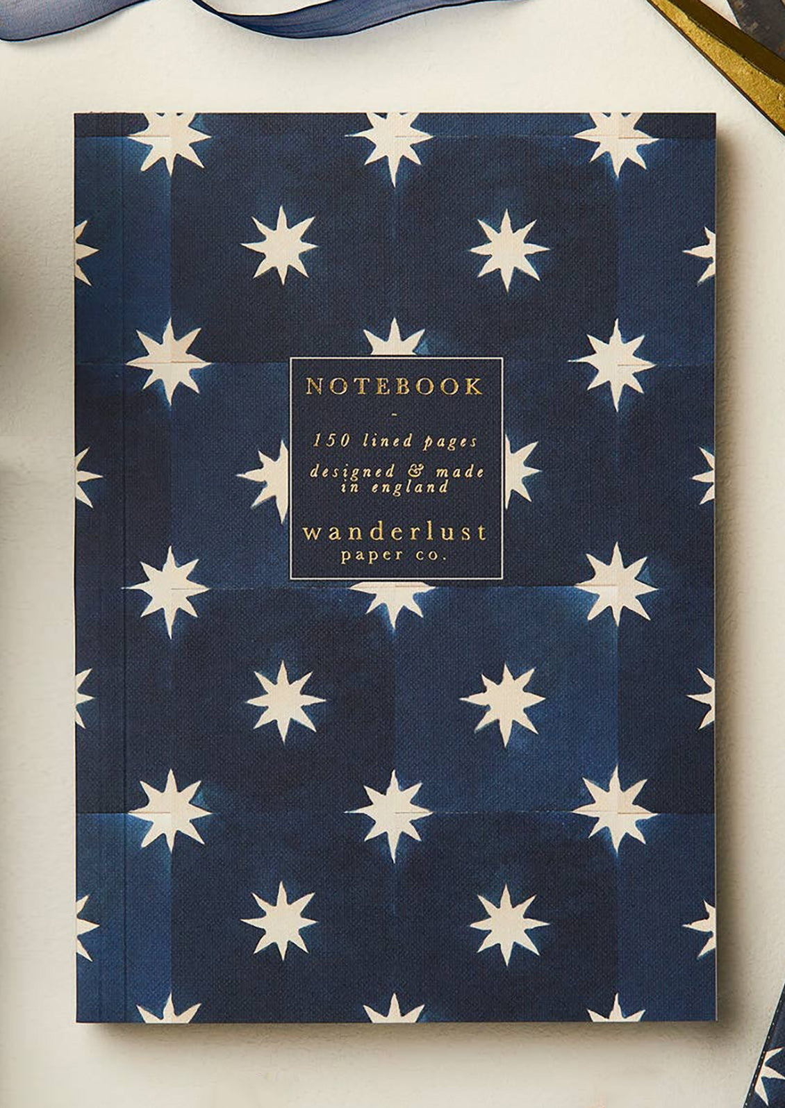 A navy and star floral print notebook.