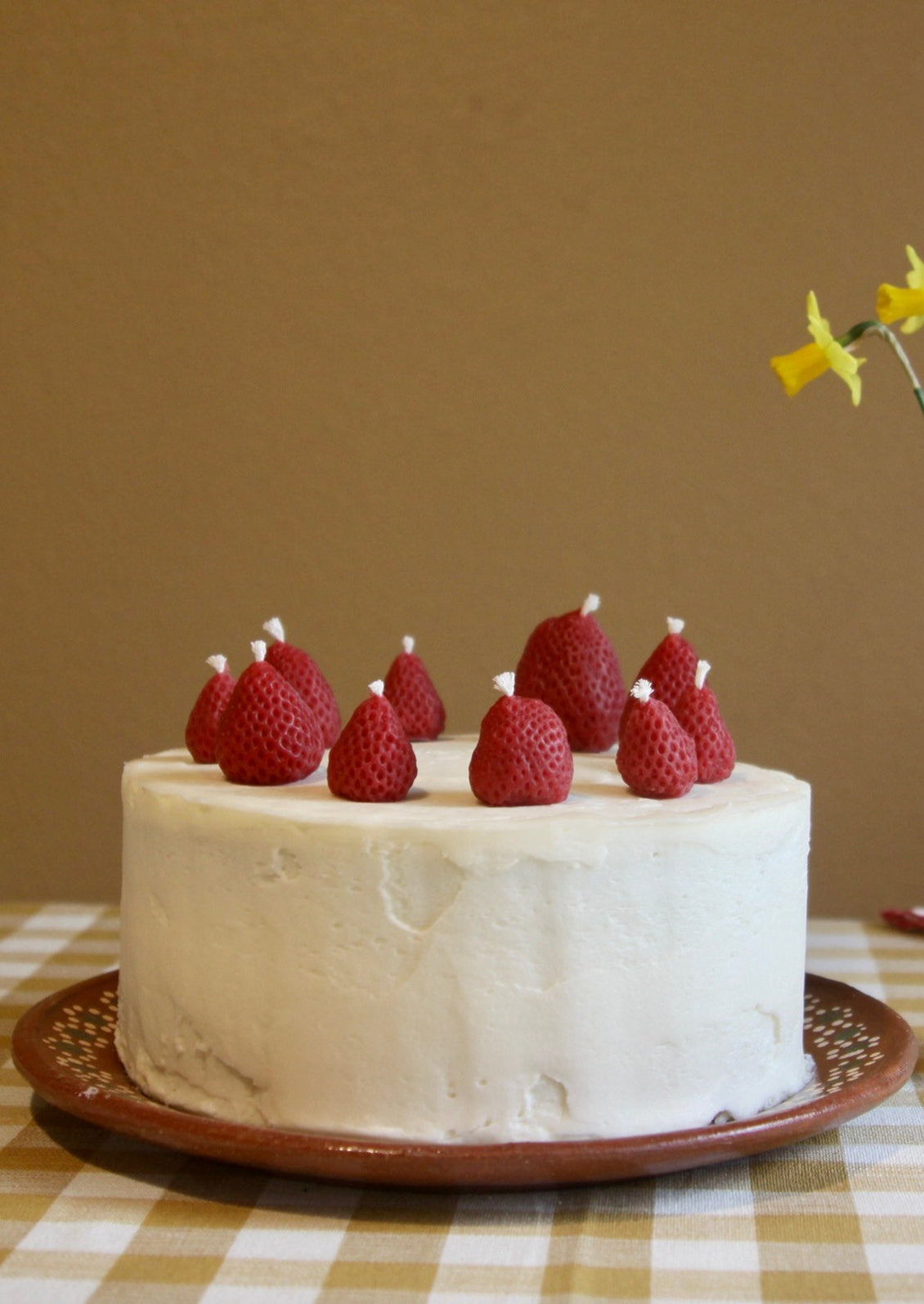 Birthday candles in the shape of strawberries.