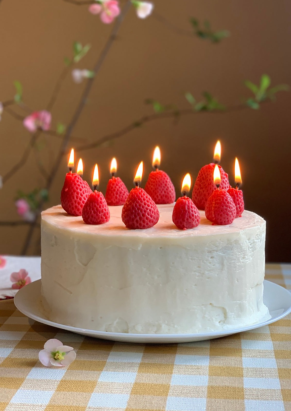 Birthday candles in the shape of strawberries.