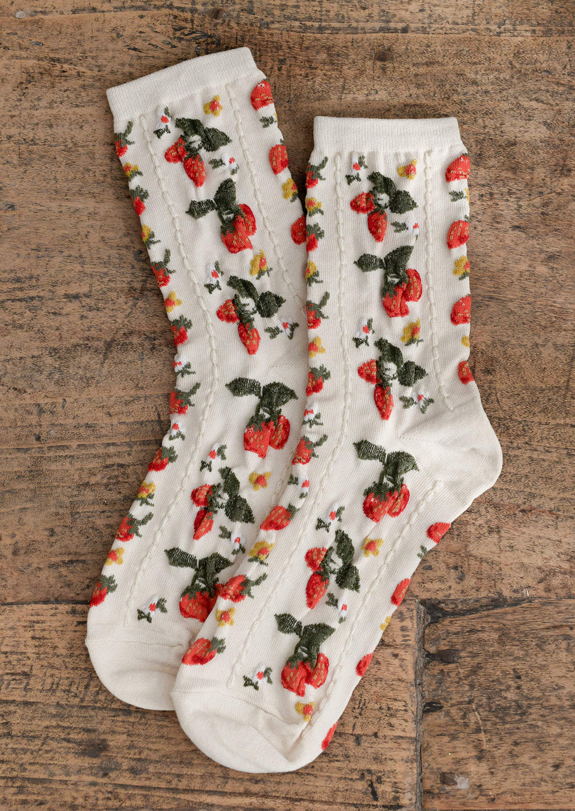 Ivory socks with red, white and yellow strawberry flower print.