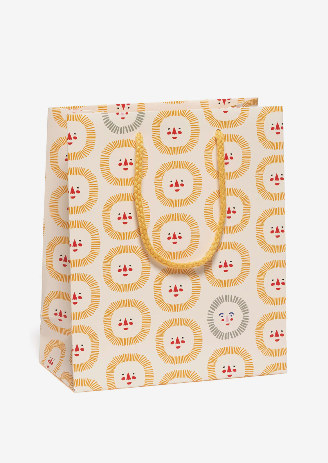 A printed gift bag with smiling sun face print on cream background.