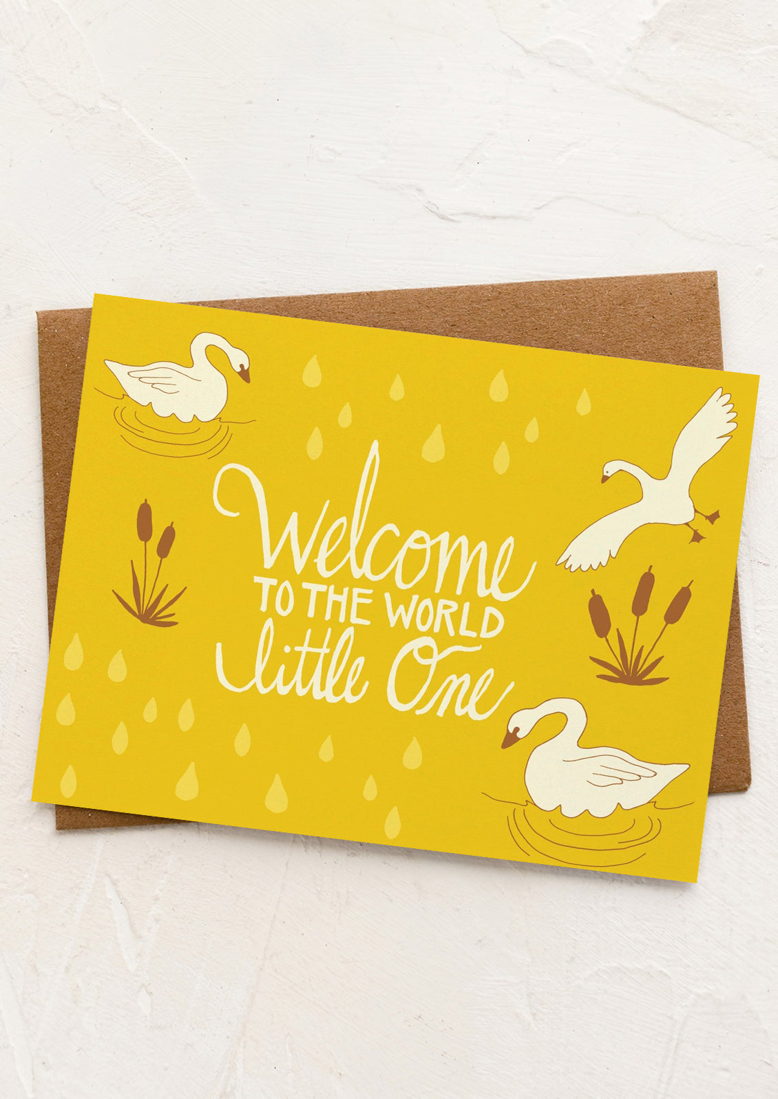 A swan print card reading "welcome to the world little one".