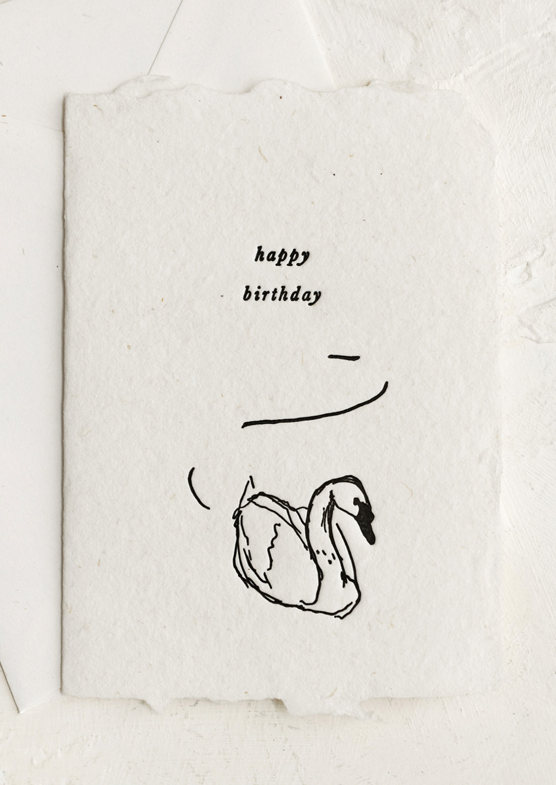 A natural handmade paper card with swan "Happy Birthday".