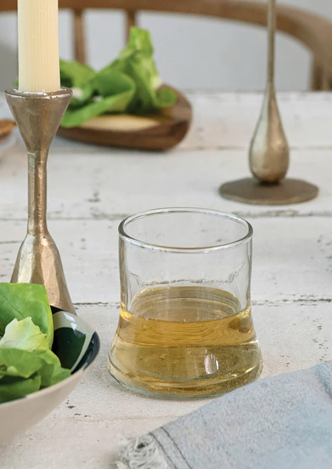 A tapered drinking glass on a table.