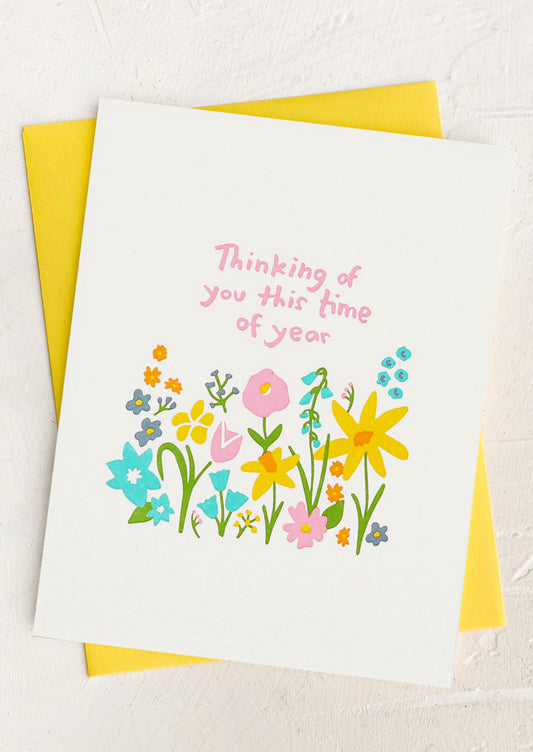 A floral print card reading "Thinking of you this time of year".