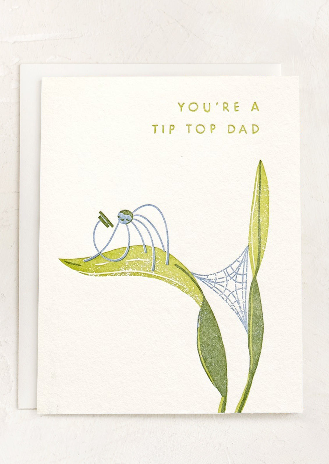 A greeting card reading "You're A Tip Top Dad".