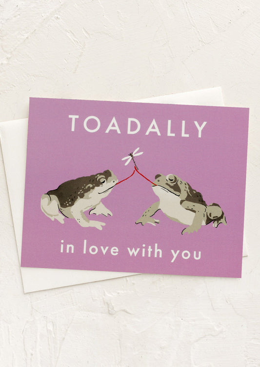 A purple card with image of two toads, text reads "Toadally In Love With You".